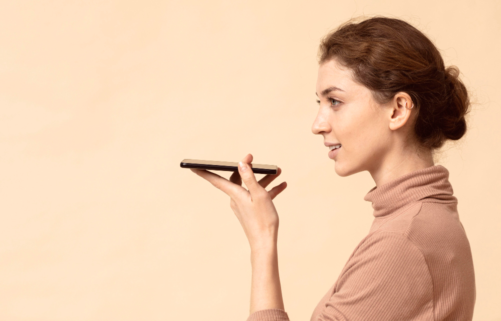 woman speaking through a phone