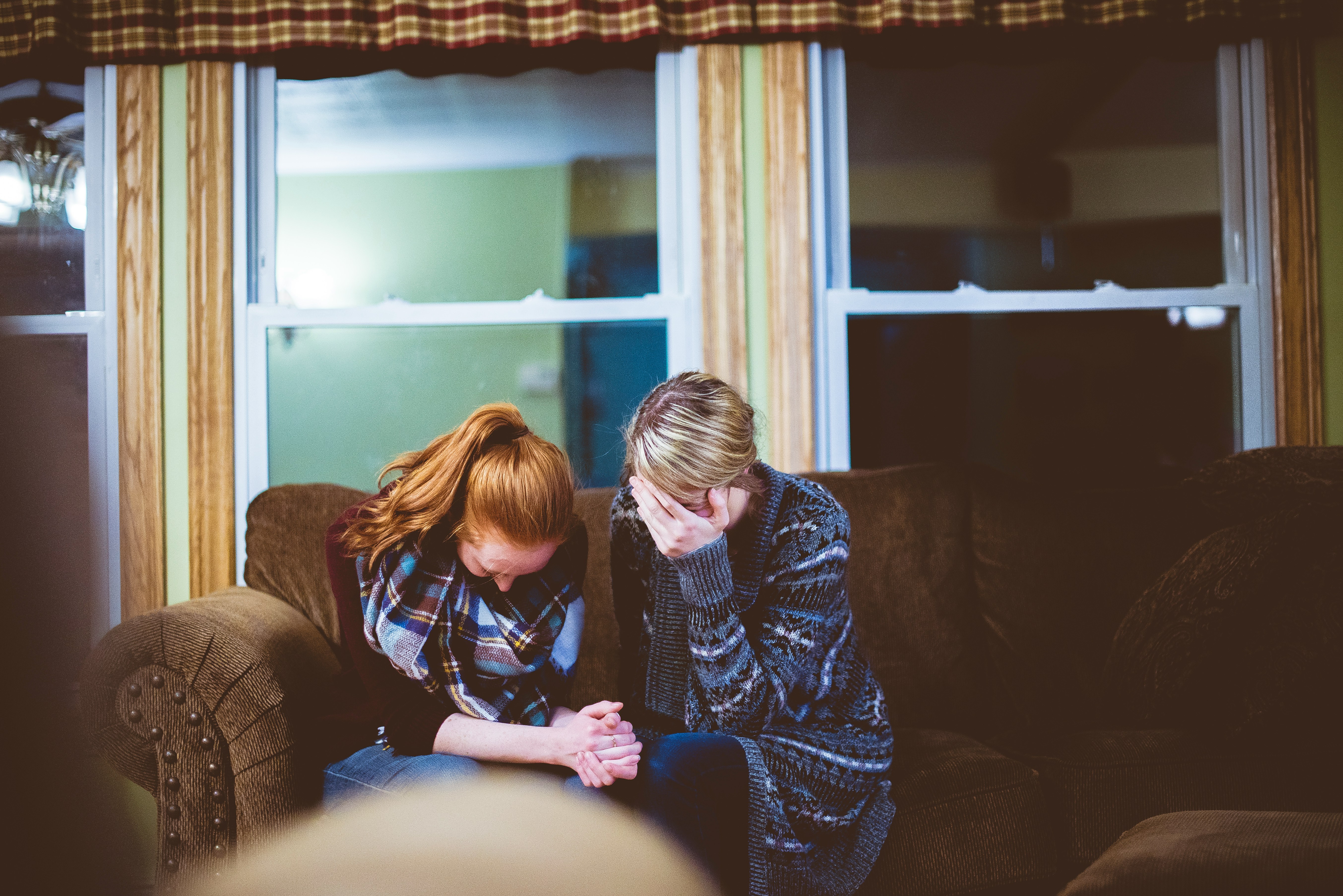 two people comforting each other