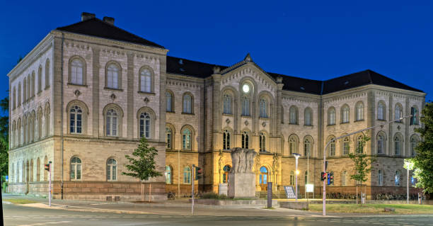 Illuminated Ernst-August-University Goettingen at night Illuminated Ernst-August-University Goettingen at night University of Göttingen stock pictures, royalty-free photos & images