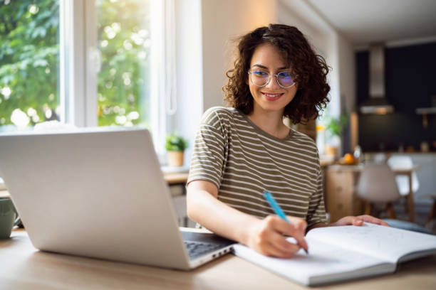 Young woman, a university student, studying online. Young woman, a university student, studying online. Research stock pictures, royalty-free photos & images