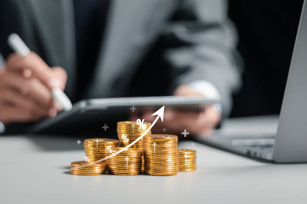 Businessman collecting coins with profit chart analysis business growth, profit growth management and corporate financial statistics. finance and investment concept. stock photo