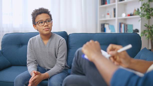 young boy having session with his terapist