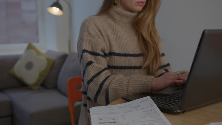 Lady Writing on Laptop