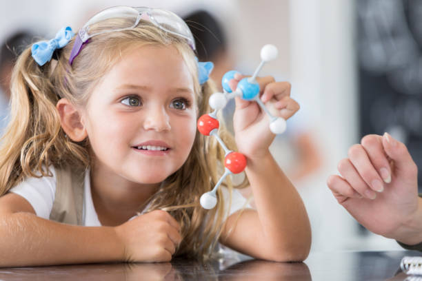 Elementary school student in science class stock photo